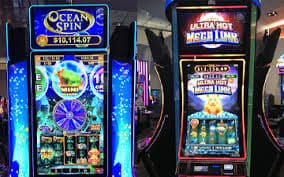 Layar informasi game menampilkan tabel pembayaran dan penjelasan fitur bonus